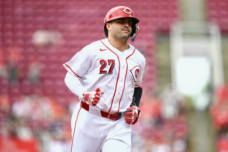 Reds ease by Pirates, 12th straight win for Burns
